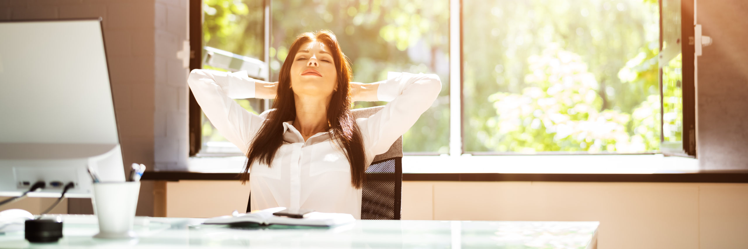Open Window In Office with Woman with Brown Hair Breathing Fresh Air