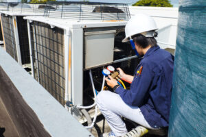 Technician is checking air conditioner