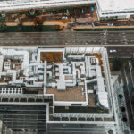 Aerial view of HVAC system on the roof top. Complex air conditioning system with pipes on the top of the office building.