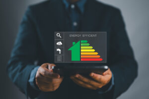 A person displaying a smartphone screen being used to show a building's energy efficiency rating.