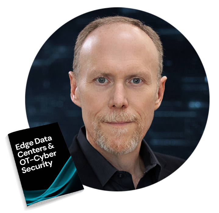 circle_fred Head-and-shoulders portrait of a man with light brown hair and goatee, wearing a black shirt, with a book titled '16 STEPS' resting nearby.