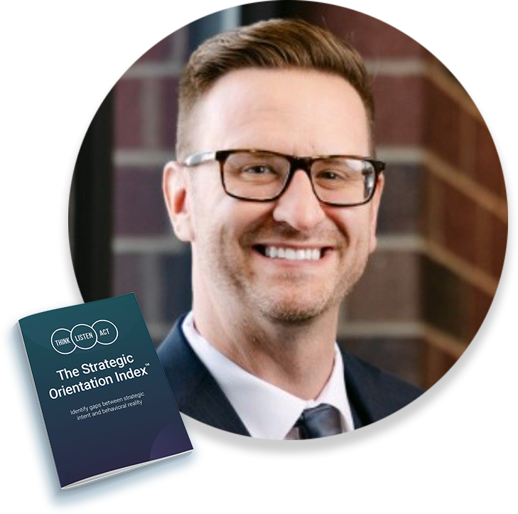 circle_kyle Smiling man wearing glasses in a circular crop, with The Strategic Orientation Index book in the foreground.