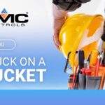 Blog banner for KMC Controls: title 'Stuck on a Bucket' with a worker holding a yellow hard hat and tool belt against a blue gradient background.